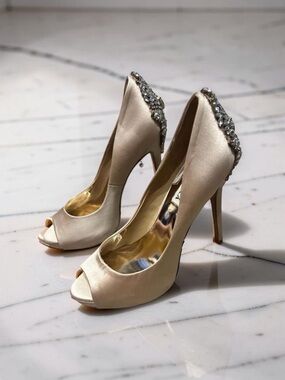 Badgley Mischka Kiara peep-toe pumps, featuring a prominent crystal-embellished
